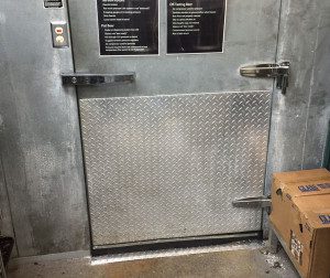 A door that is open and has metal steps.